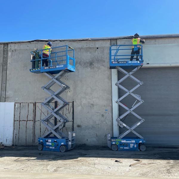 workers in scissor lifts